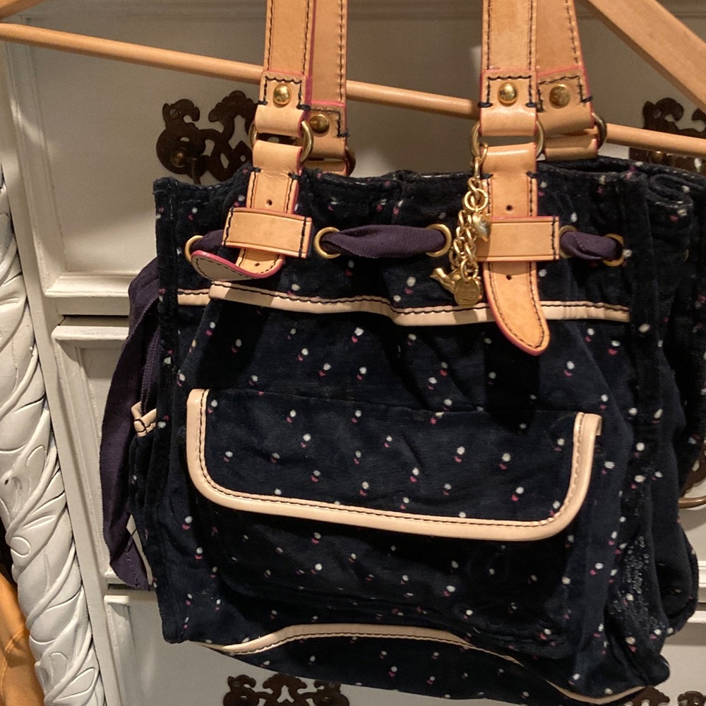 Juicy Couture Black with leather Cream trimmings and straps